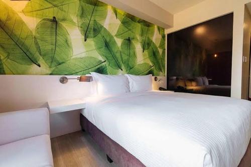 Postel nebo postele na pokoji v ubytování Maxx Hotel Makati