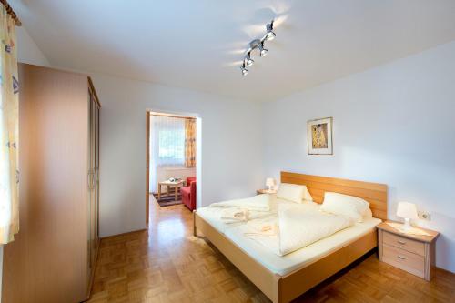 Postel nebo postele na pokoji v ubytování Hotel Turnersee