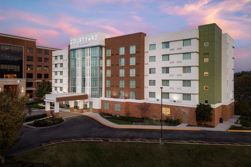 a rendering of the front of a hotel building at Courtyard by Marriott Knoxville West/Bearden in Knoxville