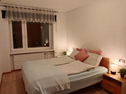 a bed in a room with a window and a bed sidx sidx sidx at City center Raua apartment with balcony in Tallinn