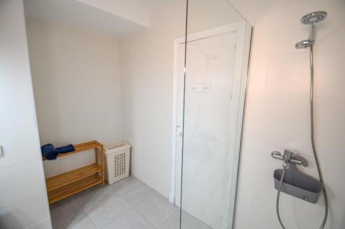 a shower in a bathroom with a glass door at Ático centro Tarifa in Tarifa