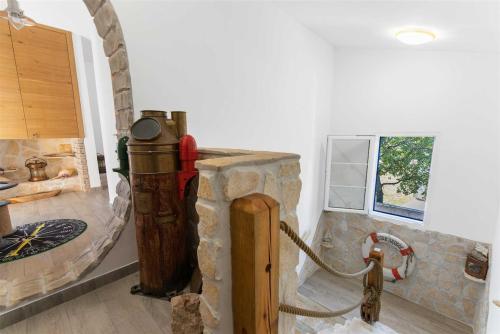a room with a stone shower with a hose at Villa Lea Lana Vinodol by aneo travel in Novi Vinodolski