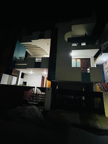 a view of a building in a dark room at Stay Confo Villa in Puducherry
