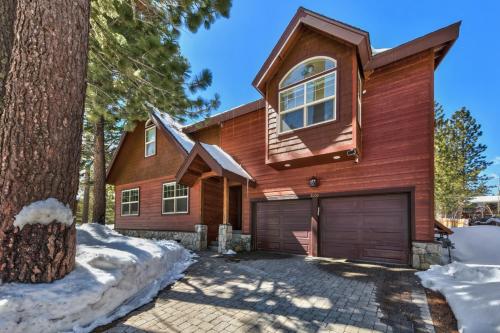 a wooden house with a garage at Tall Pines in South Lake Tahoe