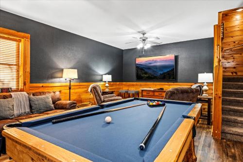 a living room with a pool table in it at Near Dollywood with Pool Table-Hot Tub-Fire Pit-Game Room in Pigeon Forge