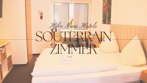 a room with two beds and a sign that reads southern ammer at Hike Inn Hotels by Emmerich in Winningen