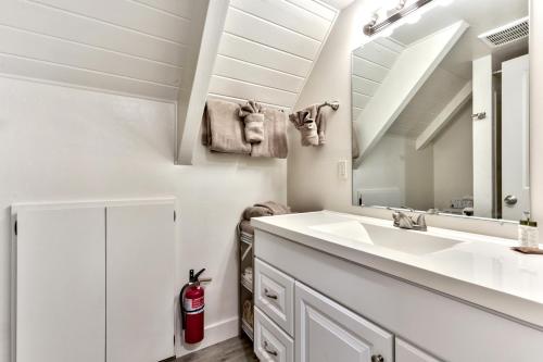 a bathroom with a sink and a mirror at 2782B Tahoe River Chalet in South Lake Tahoe