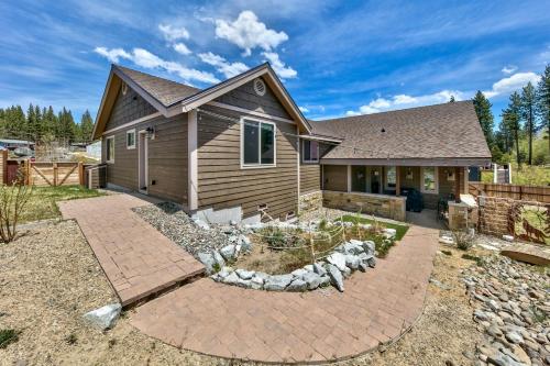 a house with a garden in front of it at 1008C Mountain View Retreat in South Lake Tahoe
