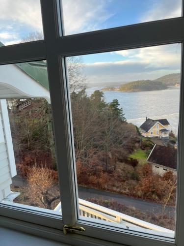 a window with a view of the water at Fräknero in Ljungskile