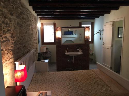 a bathroom with a sink and a sink at Maison Kyriakou in Stavrinídes