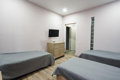 Ein Bett oder Betten in einem Zimmer der Unterkunft Almarini Guesthouse