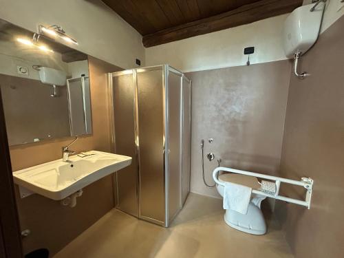 a bathroom with a sink and a shower and a toilet at Palazzo Contelori in Terni