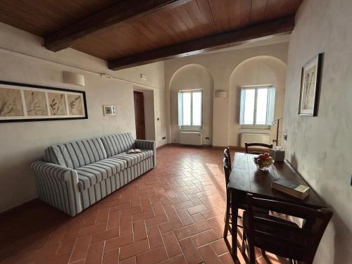 a living room with a couch and a table at Palazzo Contelori in Terni