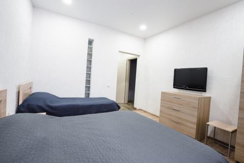 Ein Bett oder Betten in einem Zimmer der Unterkunft Almarini Guesthouse