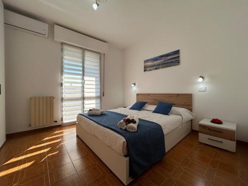 Ένα ή περισσότερα κρεβάτια σε δωμάτιο στο Lavagna in Relax & Comfort, with Balcony