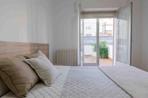 Ένα ή περισσότερα κρεβάτια σε δωμάτιο στο Apartamento San Millan Confort