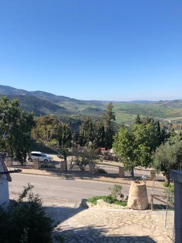 a view of a road with a mountain in the background at Casas PARAJE NATURAL in Zahara de la Sierra