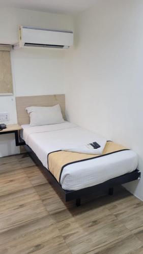Un ou plusieurs lits dans un hébergement de l'établissement Grace Residency Chennai Airport