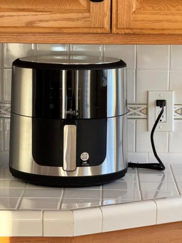 a coffee maker on top of a kitchen counter at gateway to the ocean in Hawthorne