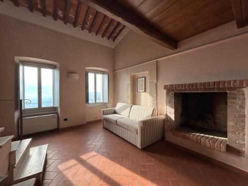 a living room with a couch and a fireplace at Palazzo Contelori in Terni