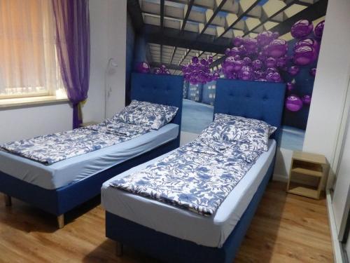 Posteľ alebo postele v izbe v ubytovaní Apartament Kraszewskiego