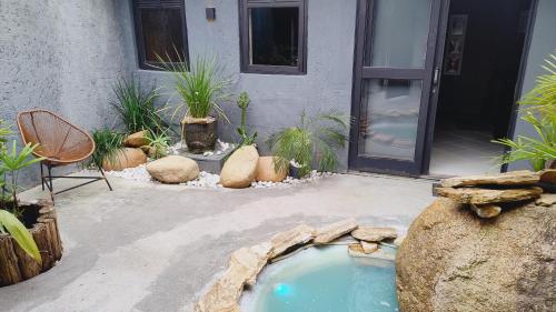 a small swimming pool in the middle of a yard at Green Flats in Florianópolis