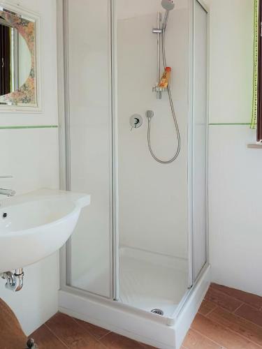 a bathroom with a shower and a sink at Inferno e Paradiso in Gradara
