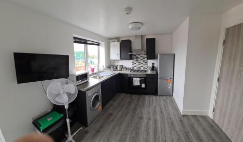 a kitchen with a sink and a stove top oven at SAV Apartments Nottingham Road 1 & 2 Bed Flats Loughborough in Loughborough