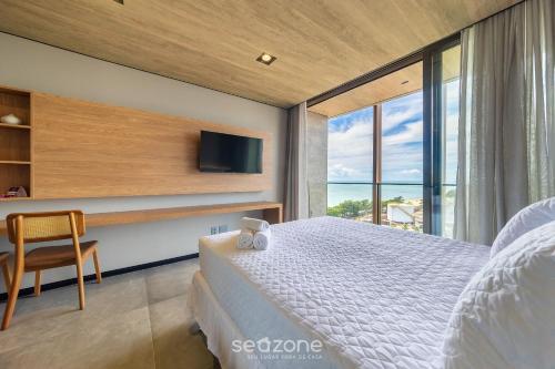 Giường trong phòng chung tại NWTs - Estúdios com Vista Lateral Mar em Maceió II