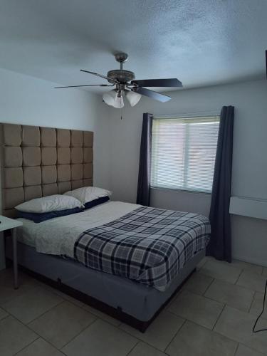a bedroom with a bed and a ceiling fan at 2 bdrm condo Las Vegas, NV in Las Vegas