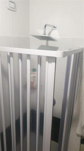 a white counter with a sink in a bathroom at Allure appartamento con piscina e posto auto in Cinquale