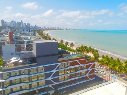 a view of the beach and a building at Icon Hotel by Welkom in João Pessoa