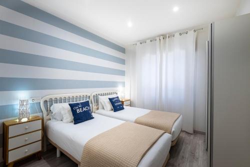 Posteľ alebo postele v izbe v ubytovaní Apartamento 2 habitaciones 140m de playa Caneliñas, P Baja-001