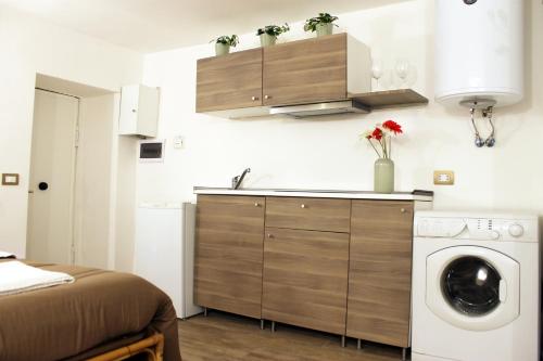 En eller flere senge i et værelse på Appartamento In Piazza