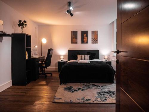 a bedroom with a bed and a desk at SAV Apartments Rutland Leicester in Leicester