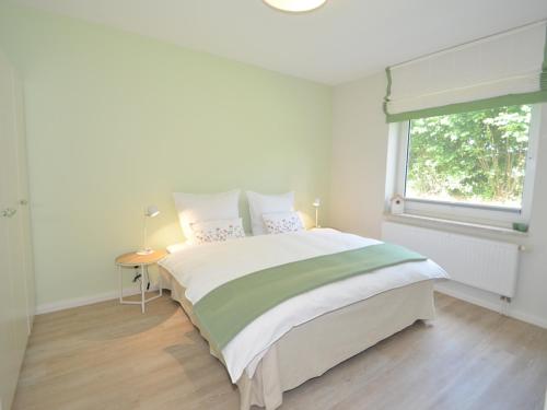 En eller flere senge i et værelse på Ferienwohnung Käthe