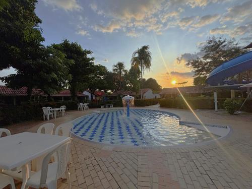 a person standing on top of a water fountain at Hotel Los Puentes Comfacundi in Girardot