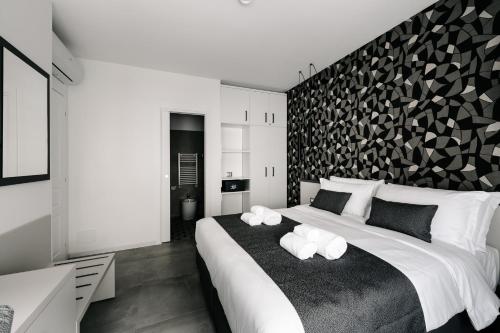 a bedroom with a large bed with two white pillows at B&B LUMAS in Rome
