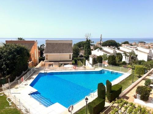 a large swimming pool in front of a house at Casa Carmen in Marbella