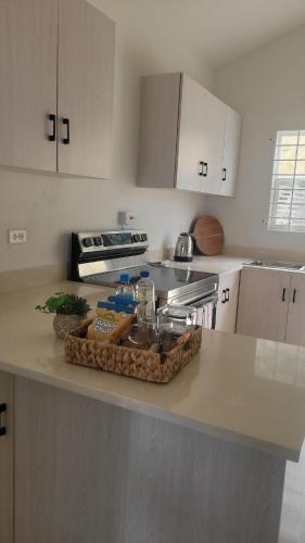 a kitchen with a tray of food on a counter at Irie Rock Cottage - Close to the Beaches and Attractions, Spa Treatment- Discovery Bay, St Ann in Discovery Bay