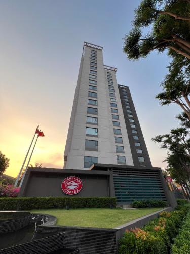 a building with a sign in front of it at Vinh Hoi Apartments - Luxury Apartment Furnished Suites in Ho Chi Minh City