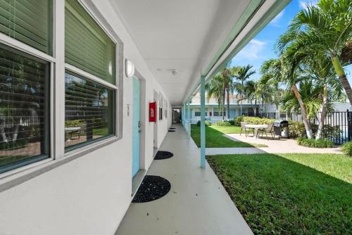 an empty hallway of a house with a yard at Lake Worth Getaway- Cozy Studio - Pool in Lantana