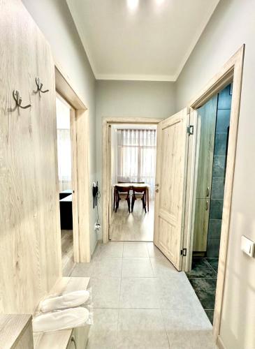 a bathroom with a table in the middle of a room at Аэропорт апартамент in Almaty