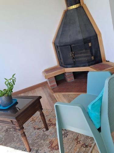 a living room with a coffee table and a fireplace at House Life in La Calera