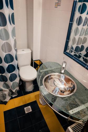 a bathroom with a sink and a toilet at Villa Despoina in Platamonas