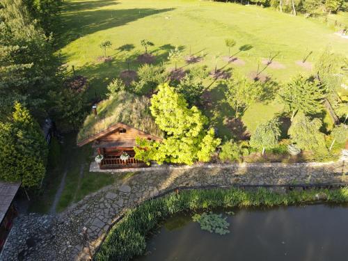 an overhead view of a house next to a lake at Srub RANCH NA HRANICI in Baška