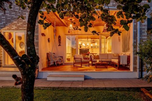 a house with a porch with a living room at RiaEncontros- Villa T4 junto Ria e Pinhal in Aveiro