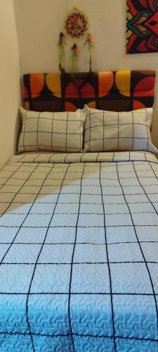 Asuncion Hostal Deluxe Pyにあるベッド