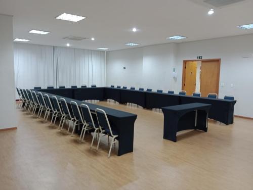 a large room with a long table and chairs at Bristol Centro Civico Curitiba in Curitiba