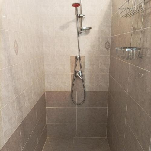 a shower with a shower head in a bathroom at Villa Annette #Vivere la Puglia in Villa Castelli